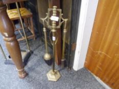 A 20th century brass three piece fireside companion set