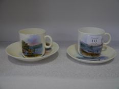 A pair of transfer printed cups and saucers each bearing a crest for the Royal Clyde Yacht Club