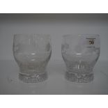 A pair of water glasses acid etched with a band of thistles