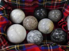 A group of eight Scottish hardstone carpet bowls, including granite, largest 10cm