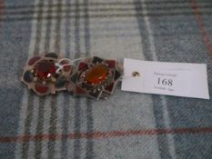 Two Scottish hardstone brooches, c. 1900, each centred by a "Cairngorm" and set with bloodstone