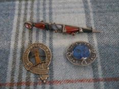 A Scottish agate brooch, modelled as a dirk, set with coloured stones mounted in unmarked white
