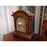 An Edwardian inlaid mahogany mantel clock, the silvered arch top dial with Roman numerals and