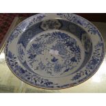 A Chinese blue and white porcelain wash bowl, the rim and well painted with floral sprays and a