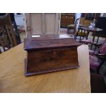 A large early 19th century rosewood twin compartment tea caddy, of sarcophagus form, the fitted