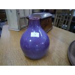 An Ashby Guild pottery vase, c. 1910, of shouldered form with streaked purple glaze, impressed mark.