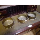 Three shell canister ashtrays, each inset with a medallion