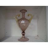 A Venetian glass vase, the amethyst body of baluster form with crimped rim and circular domed