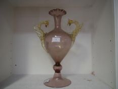 A Venetian glass vase, the amethyst body of baluster form with crimped rim and circular domed