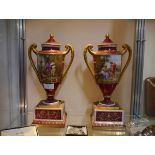 A pair of Vienna Porcelain urns and covers, late 19th century, each painted with the figure of Cupid