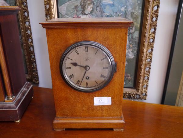 A 1920's oak cased mantel clock, for the Admiralty, the silvered dial with Roman numerals and