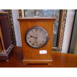 A 1920's oak cased mantel clock, for the Admiralty, the silvered dial with Roman numerals and