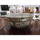 A Chinese Export punch bowl, in the famille rose palette, decorated to the interior and exterior