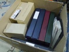 A box containing a group of World stamp albums, First Day Covers, loose stamps etc