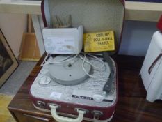 A 1960's Alba child's portable record player; together with a boxed set of Burtoys Curl Up Roll-a-
