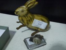 A British-made clockwork tinplate jumping rabbit (lacking key)