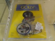A group of ten golly badges, together with a copy of the Golly Collectors Handbook and Price Guide