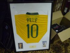 Pele (1940-), Brazil, a reproduction no. 10 shirt signed in black ink by Pele to the front, framed