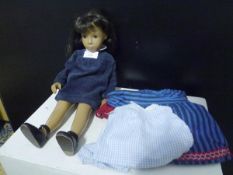 A Trendon Ltd Sasha Doll with long brown hair, brown eyes and in a blue corduroy dress, c. 1970,
