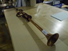 A copper hunting horn, the mouthpiece signed John Grey & Sons, London