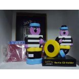 A group of advertising wares including Bassetts Allsorts CD holder