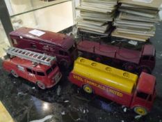 A group of Dinky model vehicles comprising: a Foden flat truck with chains in maroon no. 505; an "