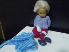 A Trendon Ltd Sasha baby doll, with blonde hair and brown eyes, c. 1968, with additional clothes