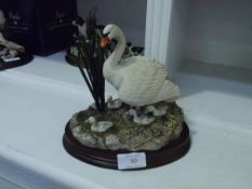 A Border Fine Arts group, First One In, (swans), on an oval base