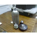 A vintage Sparklets wire-wrapped soda syphon; together with three vintage table lighters including