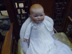 An Armand Marseilles bisque head baby doll