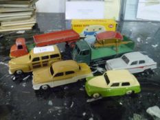 A group of Dinky model vehicles comprising: a Weekend Caravan, boxed, no. 190; a Plymouth Estate