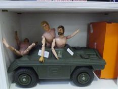 A group of 1980's Action Man figures, together with an armoured tank, clothes etc