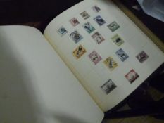 An album of GB, Empire and Commonwealth stamps, mostly George VI and Elizabeth II including Royal