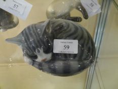 A Royal Copenhagen porcelain model of a sleeping grey tabby cat, no. 422