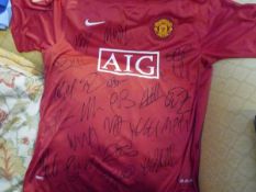 A Manchester United Football Club home shirt, various signatures