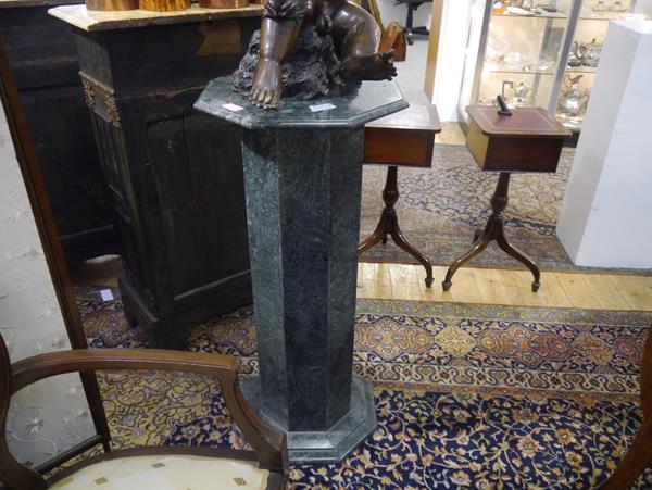 A green marble stand, the octagonal top on a conforming column and stepped base. 92cm by 42cm