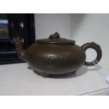 A Chinese Yixing teapot, 19th century, of compressed form, the cover with dragon finial and with