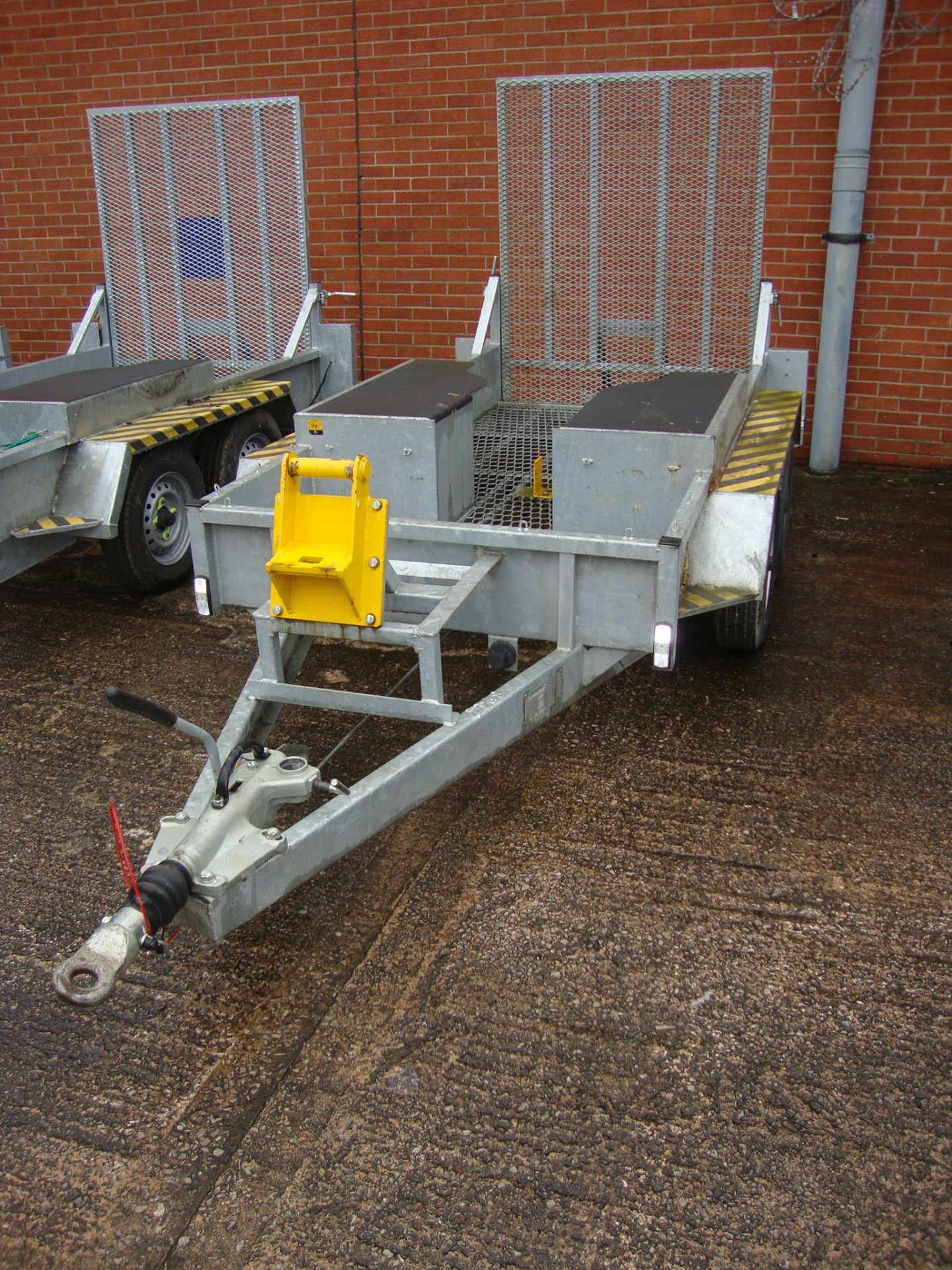 Mini digger/excavator specialist trailer incorporating large drive-on ramp at rear, shrouds for