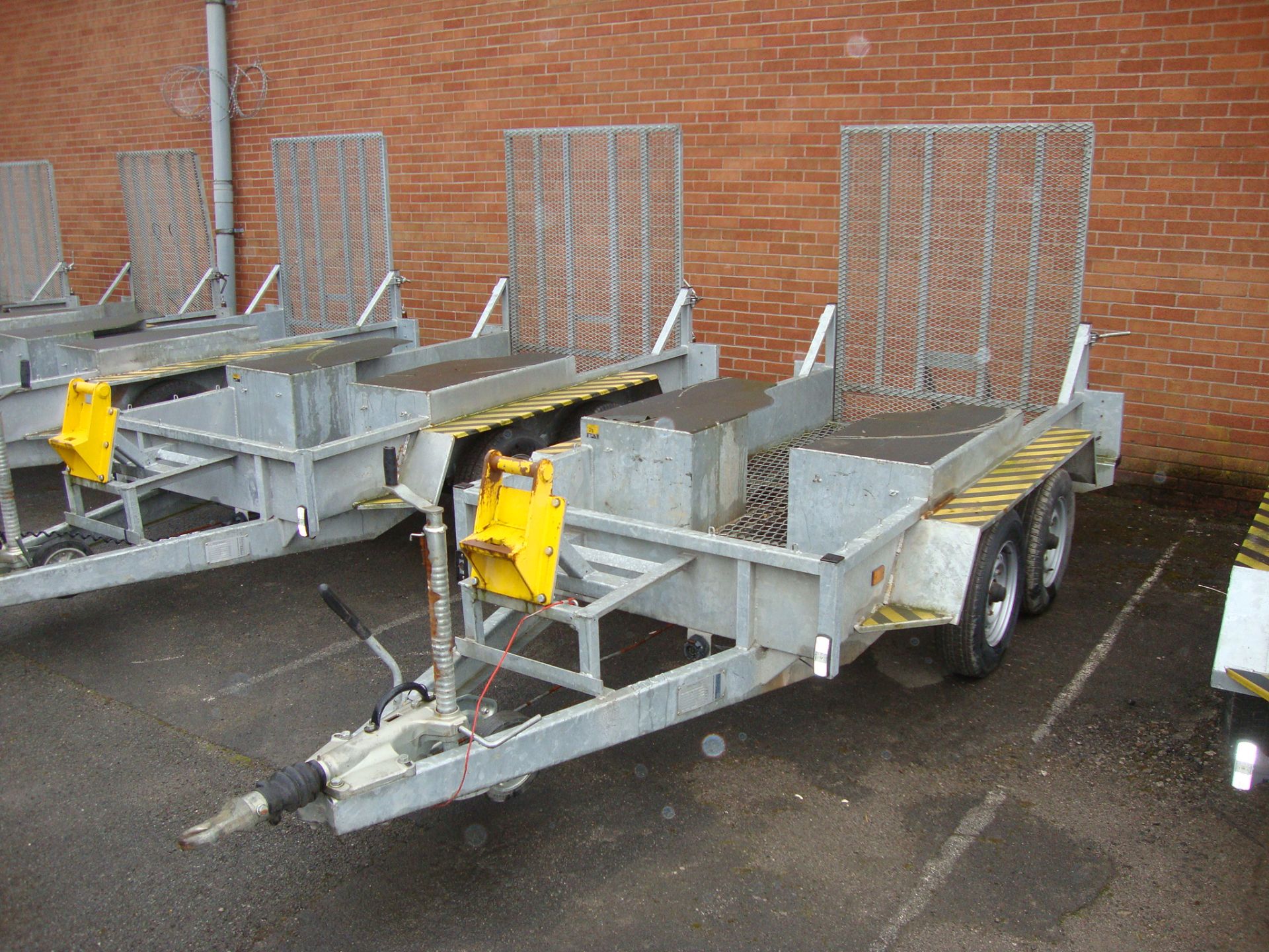 Mini digger/excavator specialist trailer incorporating large drive-on ramp at rear, shrouds for