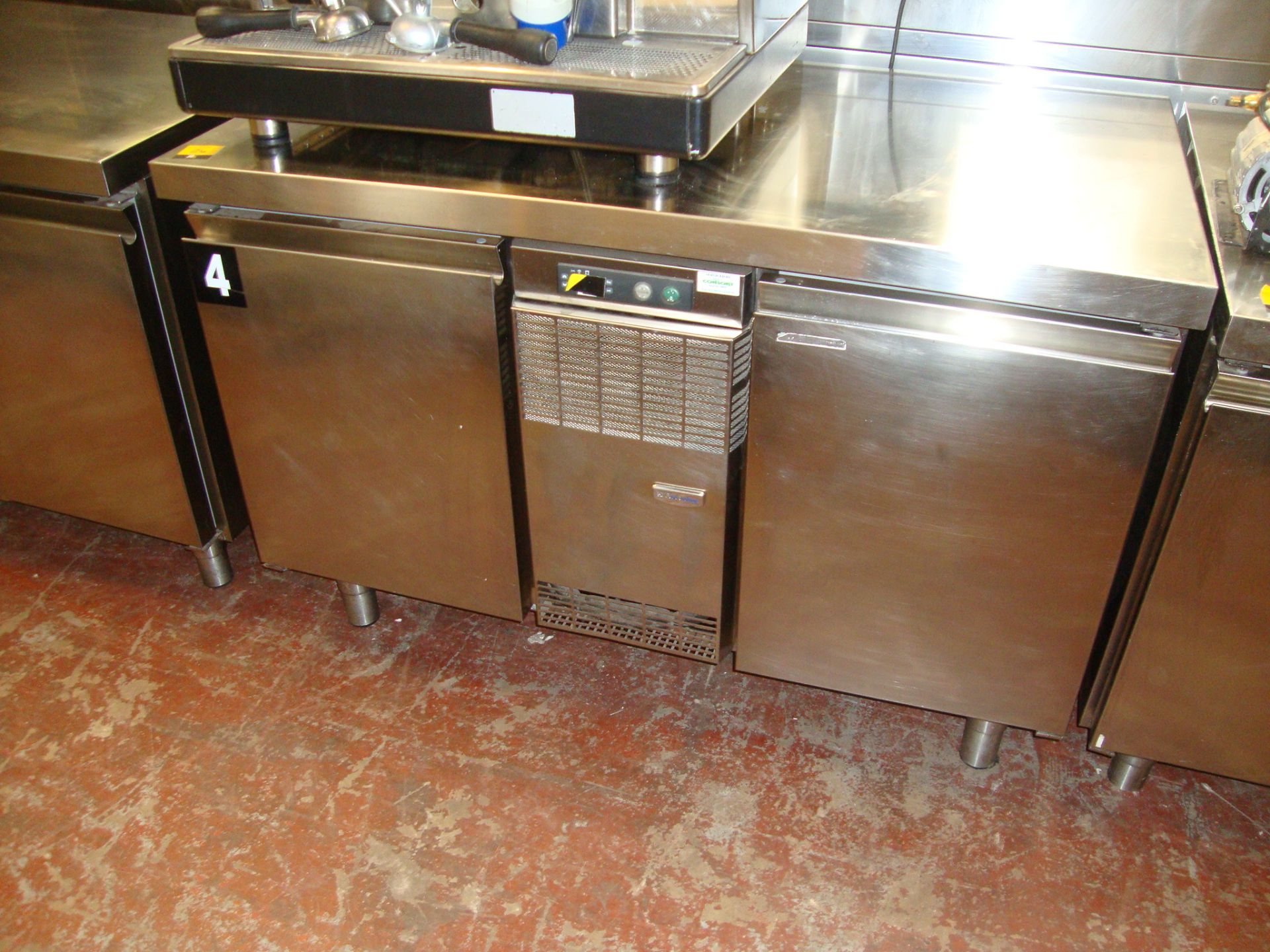 Electrolux TRN132A stainless steel prep counter with freezer compartments below same