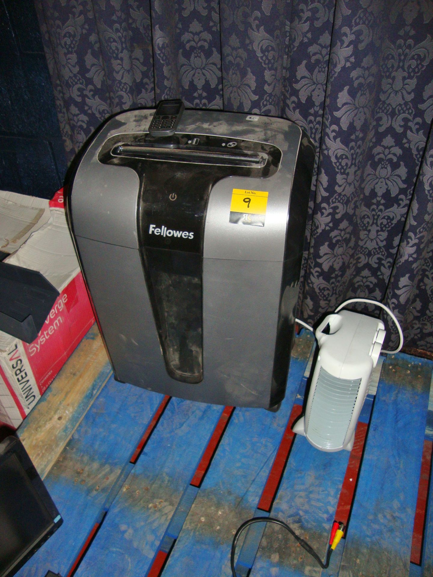 Office equipment comprising Fellowes shredder, Nokia mobile phone and small fan heater