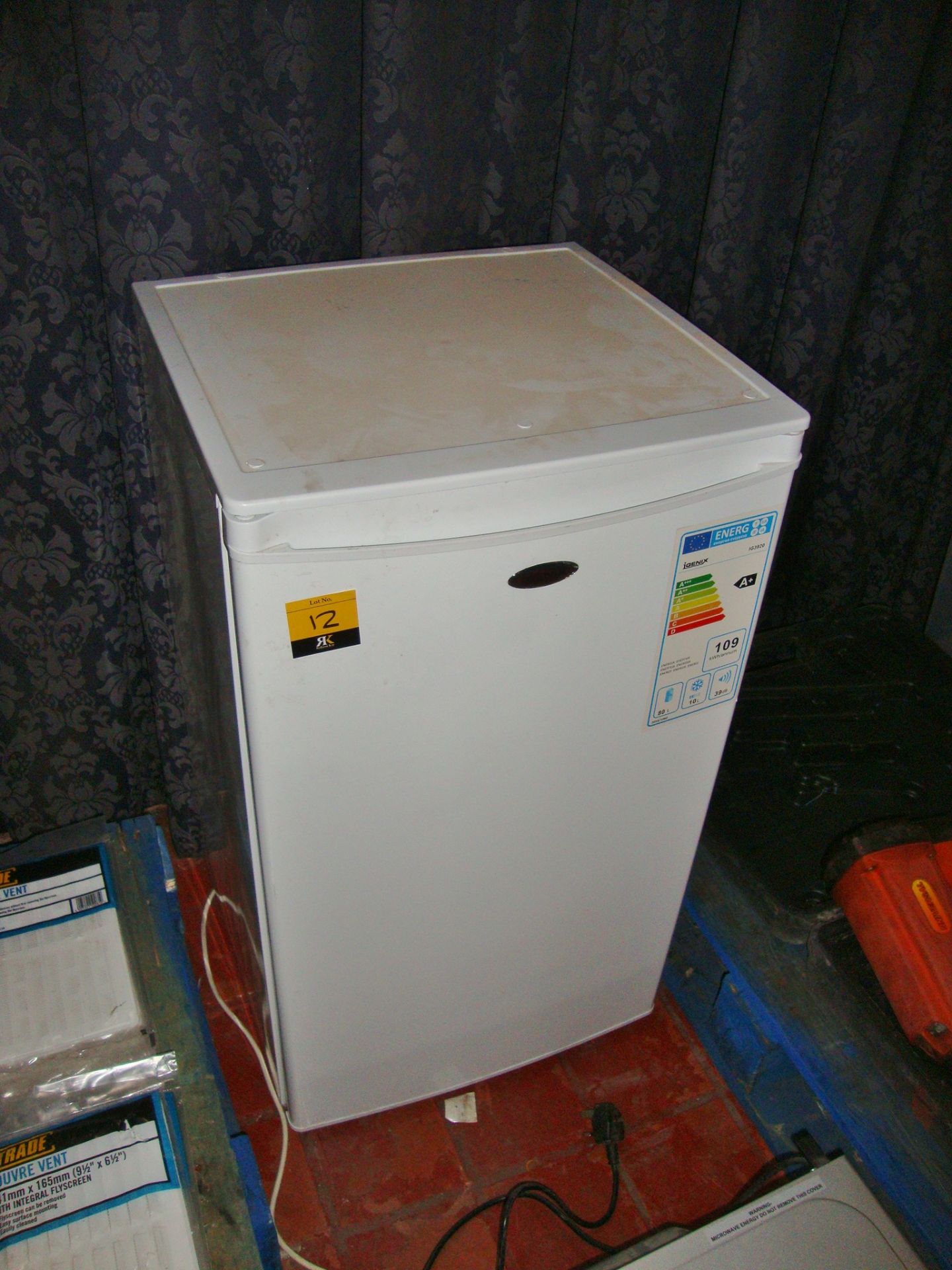 Igenix domestic counter height fridge with small freezer compartment