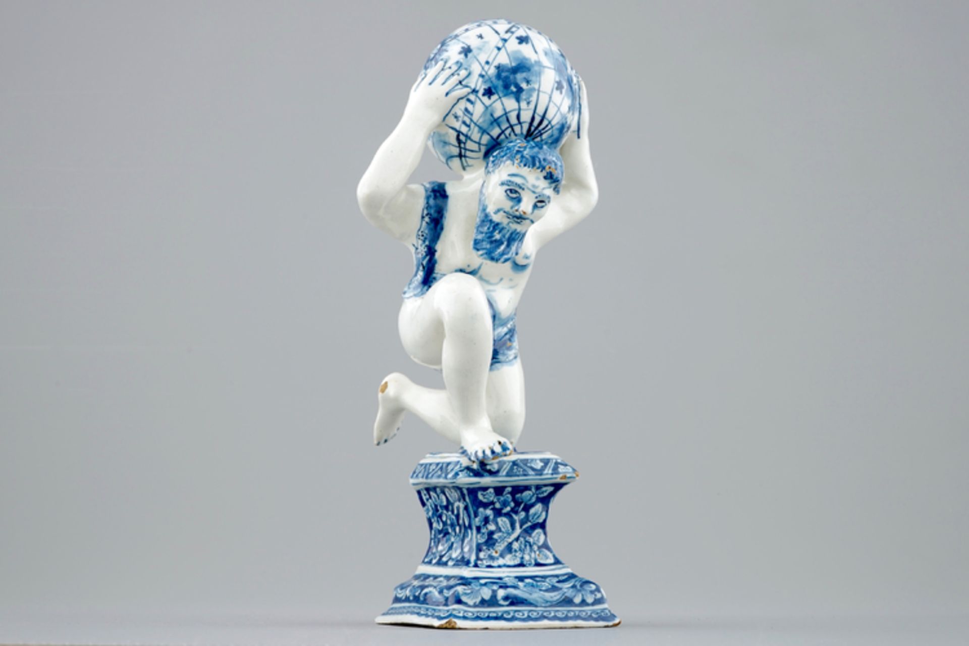 A blue and white Dutch Delft figure of Atlas, ca. 1710 - H.: 24,4 cm Condition: Excellent