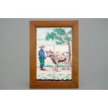 A polychrome Dutch Delft tile panel with a shepherd with cow, 19th C. - Dim.: 46,5 x 33,5 cm -