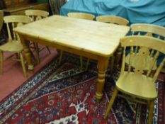 A 20th Century antique style pine table with turned legs, 78 cms high, 137 cms long, 95 cms deep
