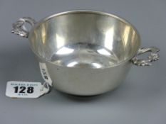 A silver quaich style two handled drinking bowl by W A Bolin, Court Jeweller, 10 cms diameter bowl