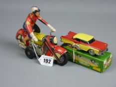 A French tinplate friction action motorcycle and rider, marked 'S F A Paris, Made in France', 17 cms