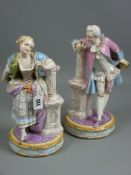 A good pair of Continental porcelain figurines, finely painted of a courting couple in colourful