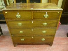 An early 19th Century mahogany chest of two short over three long drawers, pine lined with bone