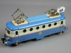 A tinplate gauge 0 electric railcar in blue and cream livery with sprung overhead line connectors,